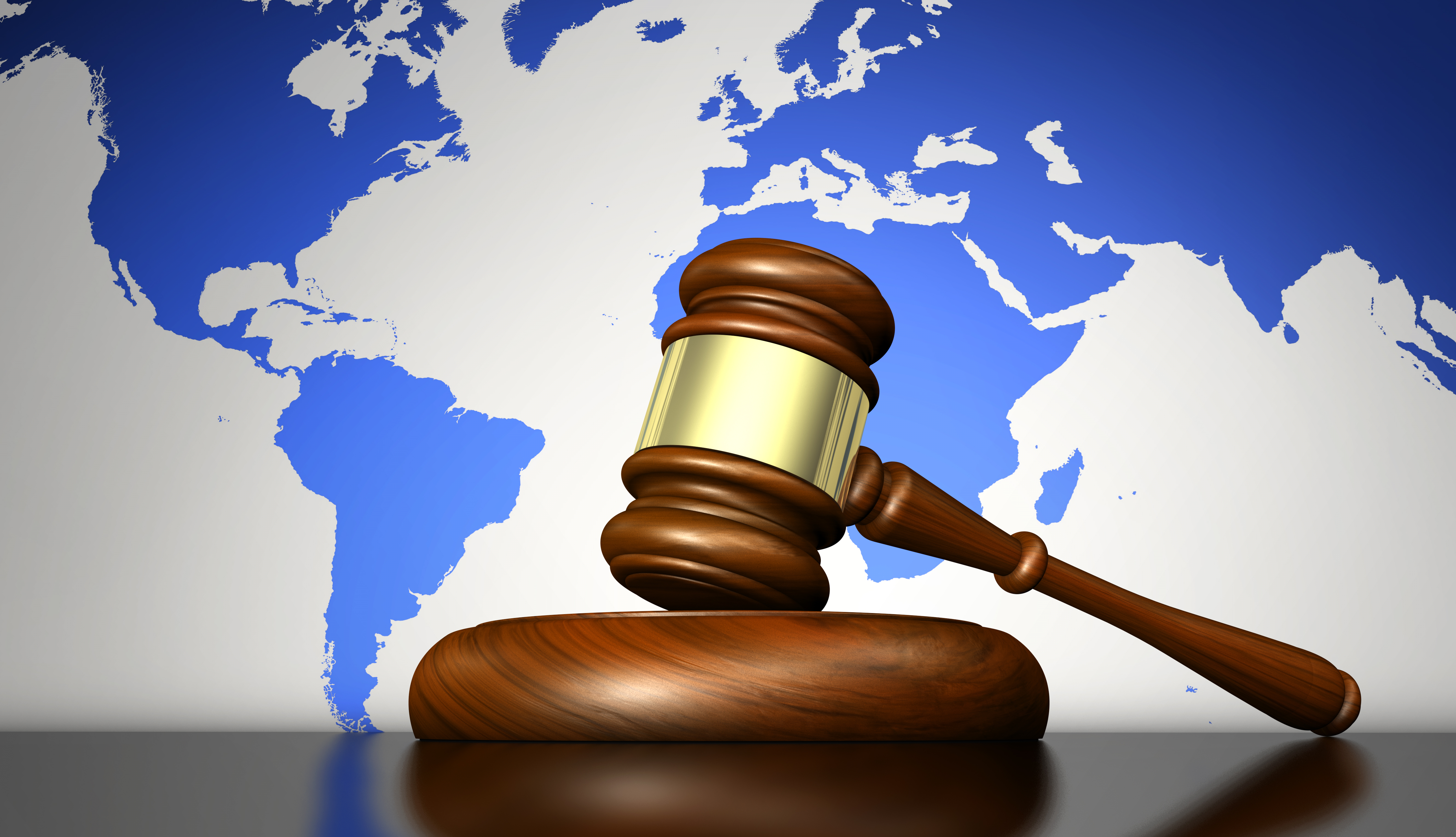 a gavel and world map on background