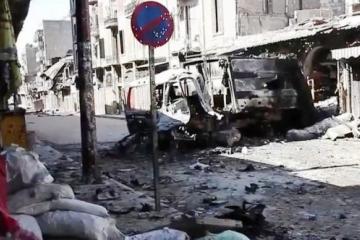 Bombed out vehicles in Aleppo