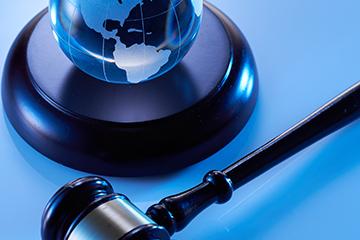 Close-up of gavel hammer and glass globe on United States